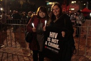 Sebuah plakat yang dibawa mereka yang menghadiri konser di sela-sela konprensi AIDS di Melbourne. (Photo: David Kim)